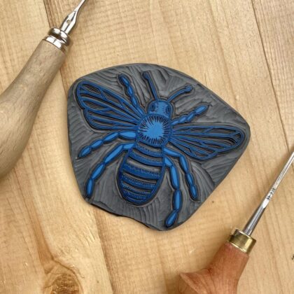 Bee carved lino block detail