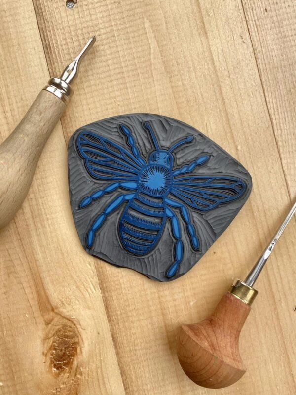 Bee carved lino block detail