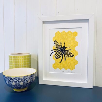 Bee framed lino cut print on display