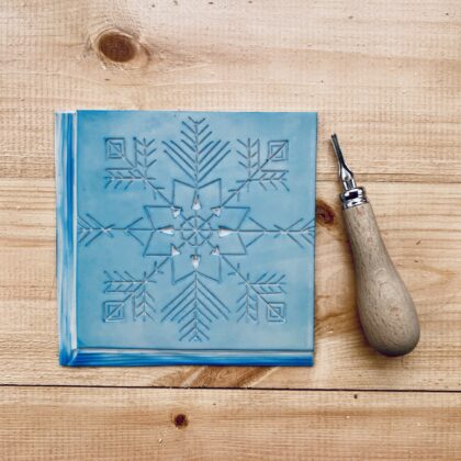 Carved snowflake lino block Carved snowflake lino block