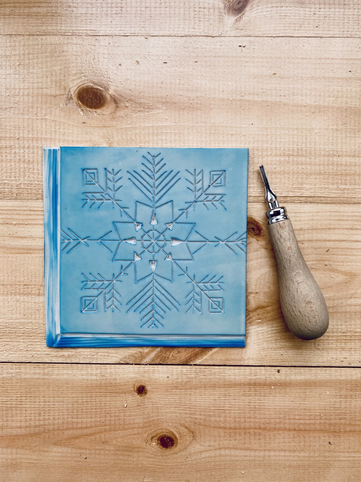 Carved snowflake lino block Carved snowflake lino block