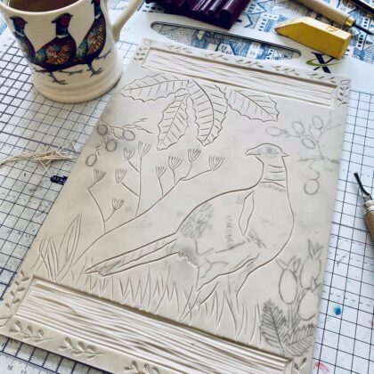 Carving progress lino block pheasant in autumn