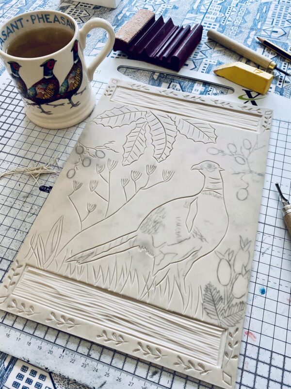 Carving progress lino block pheasant in autumn