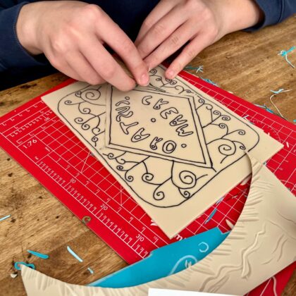 Family workshop custard cream cutting lino