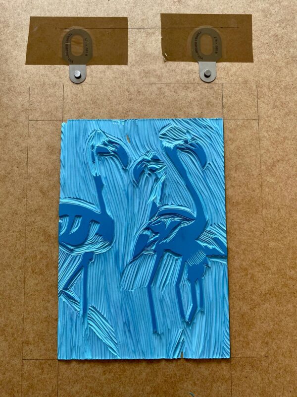Flamingos reduction linocut carved block progress
