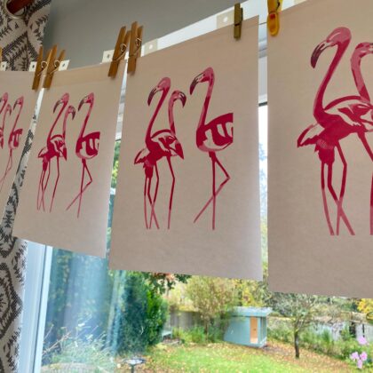 Flamingos reduction linocut print colour layers drying