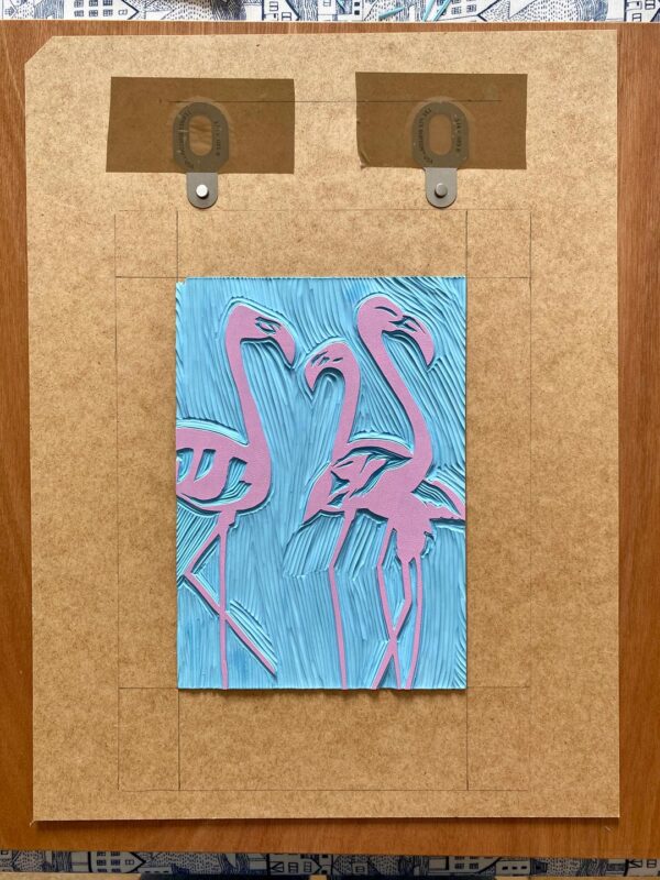 Flamingos reduction linocut print inked block
