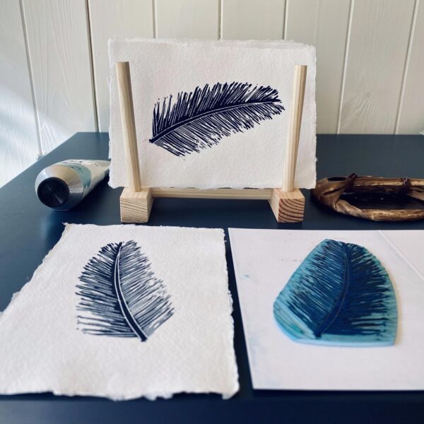 Navy pine leaf linocut print drying