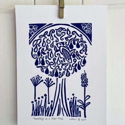 Partridge in a pear tree a5 blue linocut print close up drying