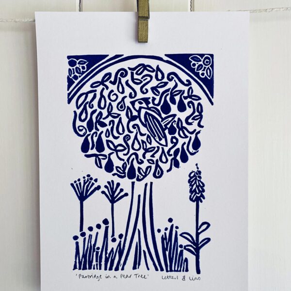 Partridge in a pear tree a5 blue linocut print close up drying