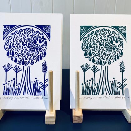 Partridge in a pear tree lino prints drying