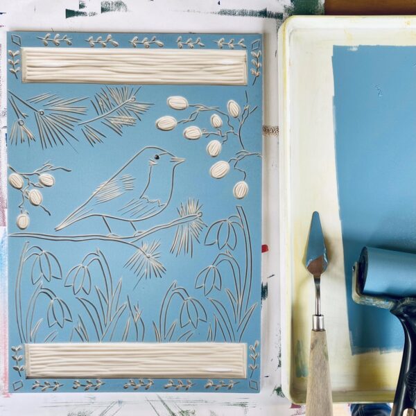 Robin in winter inked lino block