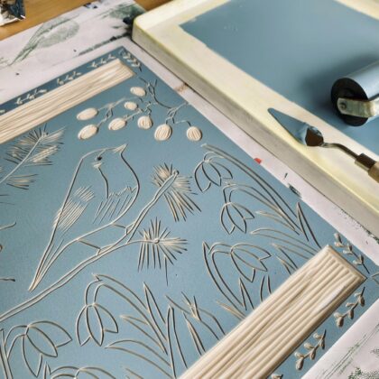 Robin in winter inked lino block detail